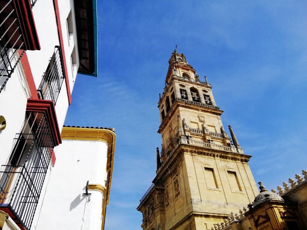 low angle shot bell tower great mosque cathedral cordoba spain with blue sky