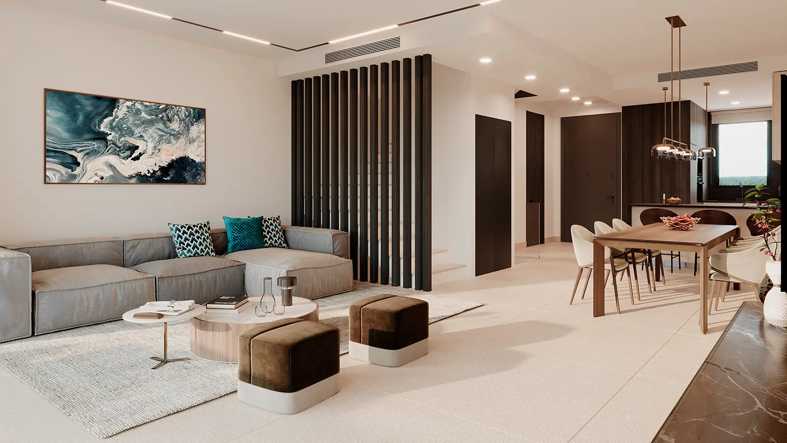 Bright open-plan living and dining area with grey sofa and wooden table at Serenity Hills