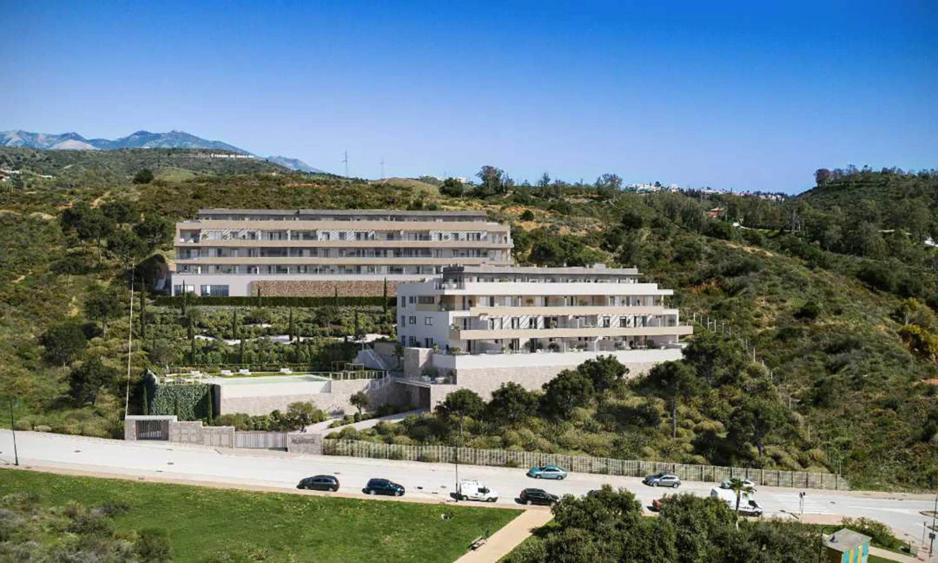 Aerial view of Almare Cala de Mijas residential complex surrounded by nature and sea views