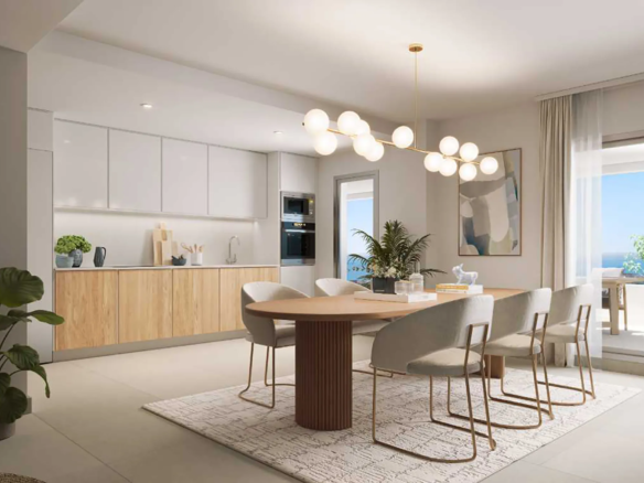 Modern open-plan kitchen and dining area in Almare Cala de Mijas apartment with minimalist design and natural light