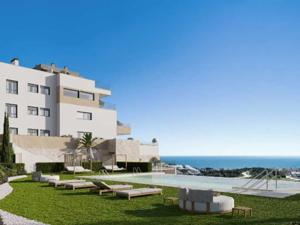Communal swimming pool and landscaped gardens in Almare Cala de Mijas luxury residential developmen
