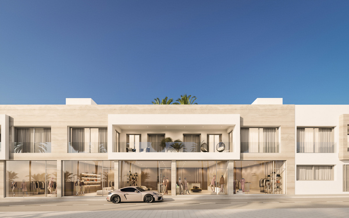Alcantara del Mar Apartments – San Pedro de Alcántara - luxury mixed-use facade with ground-floor boutique retail and upper residential terrace
