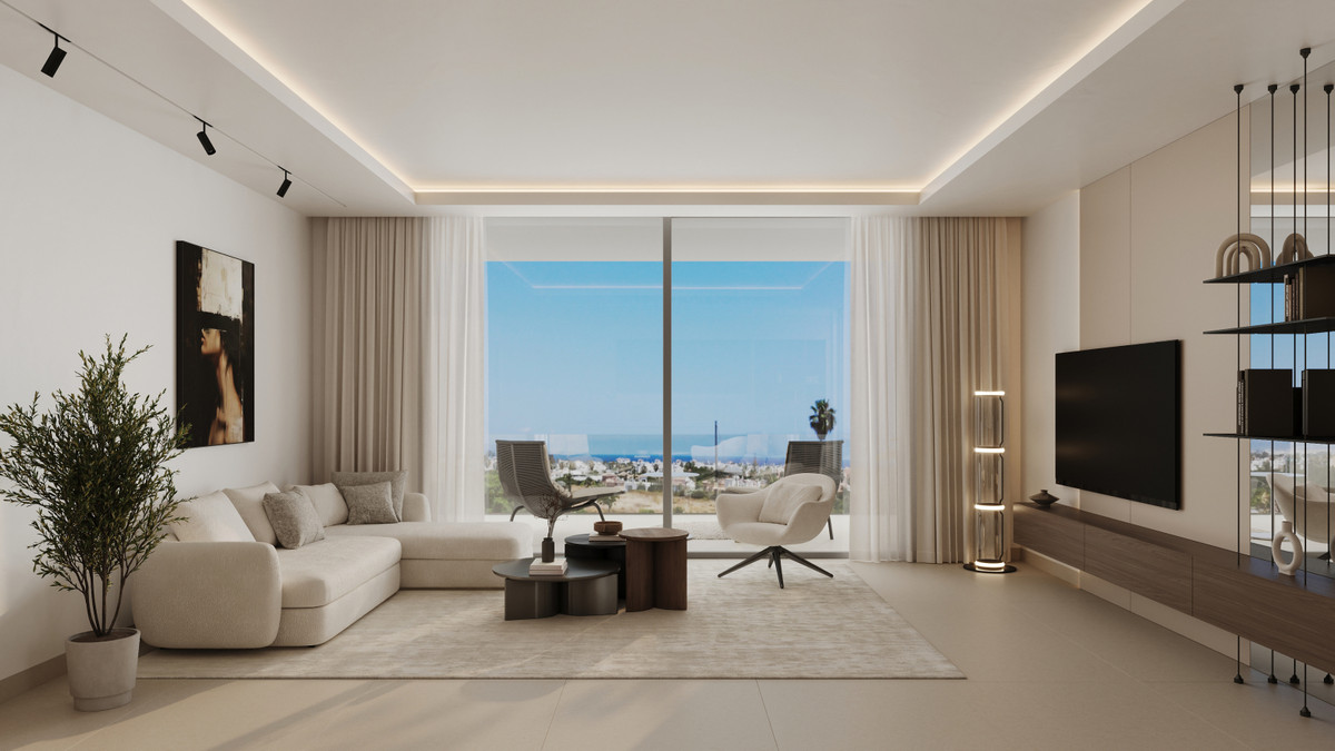 Alcantara del Mar Apartments – San Pedro de Alcántara - bright modern living room with cream sofa, floor-to-ceiling glass doors and sea views