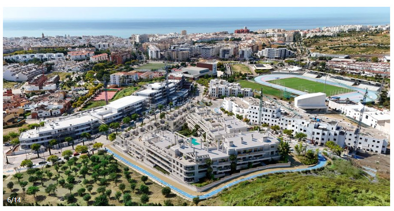 Anna De Estepona – Townhouses – Estepona - aerial view of white modern development with pool, surrounded by greenery and coastline