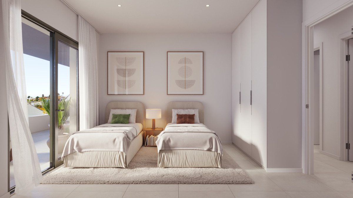 Astra Homes – Fuengirola - twin bedroom with balcony access, built-in wardrobes and neutral modern décor