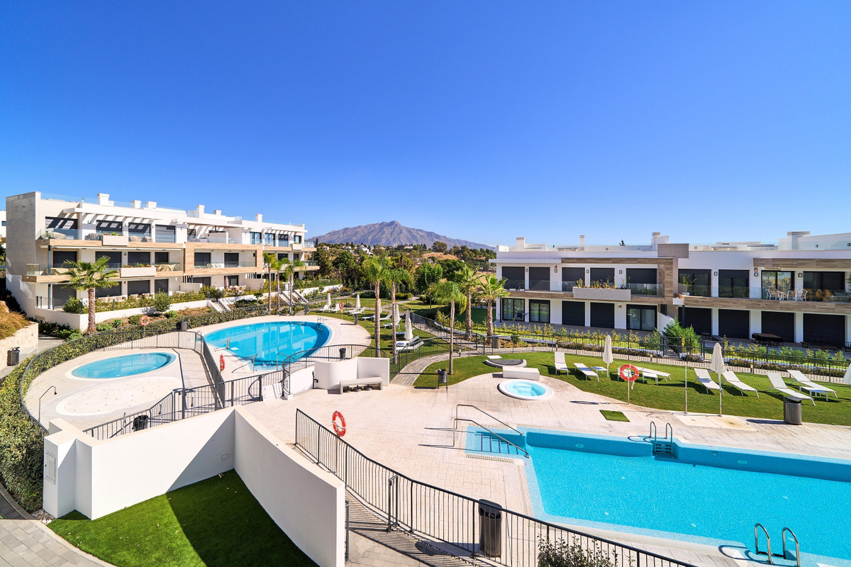 Atalaya Emotion – Estepona - luxury outdoor pools, jacuzzis, manicured gardens and contemporary residential buildings with mountain backdrop