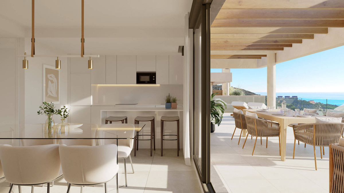 Atria – Phase 1 – La Alcaidesa - open keuken en eethoek met terras en zeezicht