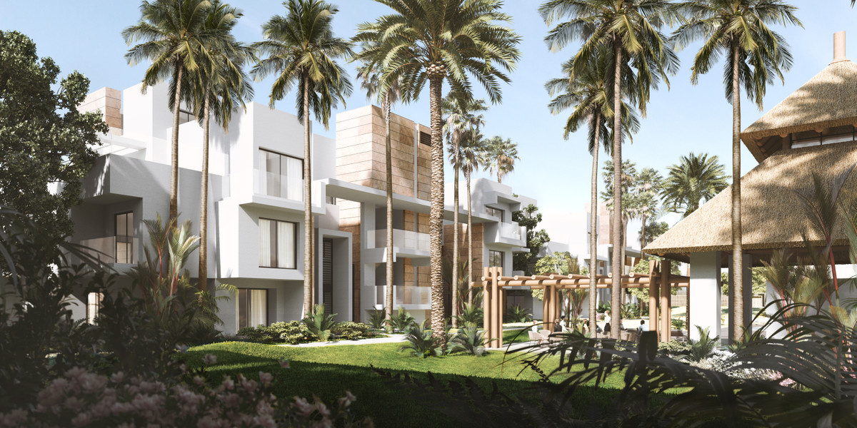 Ayana Estepona – New Golden Mile - moderne hvid boligfacade omgivet af høje palmetræer og tropiske haver