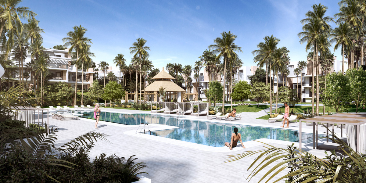 Ayana Estepona – New Golden Mile - luksuriøs fællespool omgivet af palmetræer og tropiske haver med moderne boligbyggeri