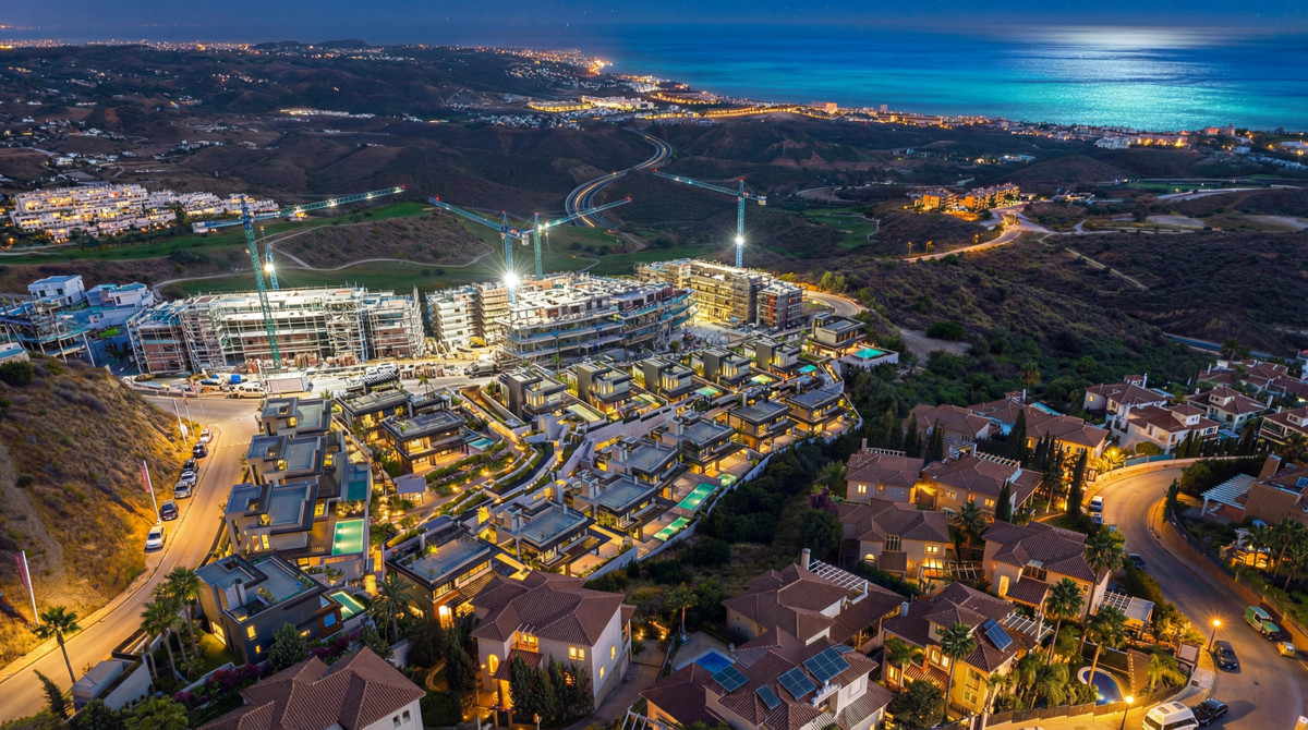 Bali Villas – La Cala de Mijas - aerial night view of luxury new-build development with pools, construction cranes, and Mediterranean Sea backdrop
