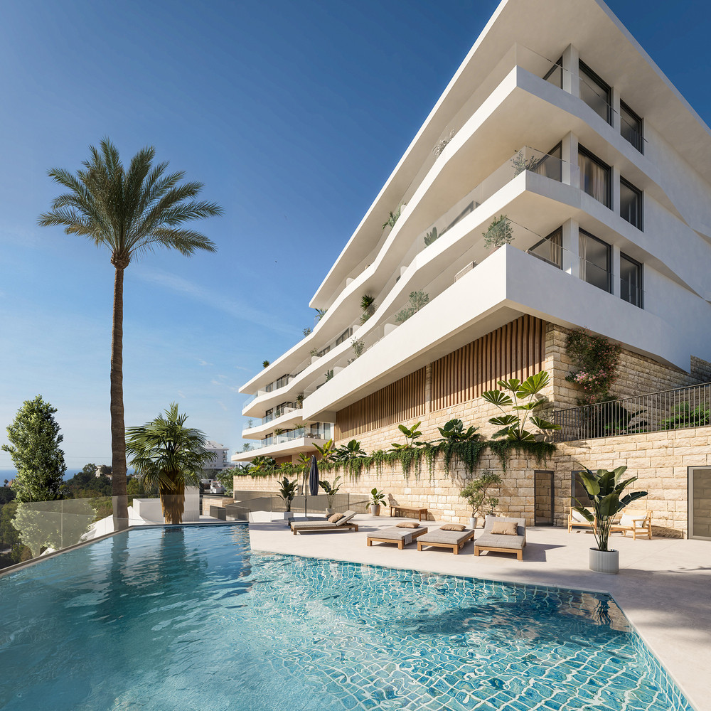 Belvedere Collection – Fuengirola - luksuriøs hvid boligbygning med udendørs pool, liggestole og tropisk beplantning