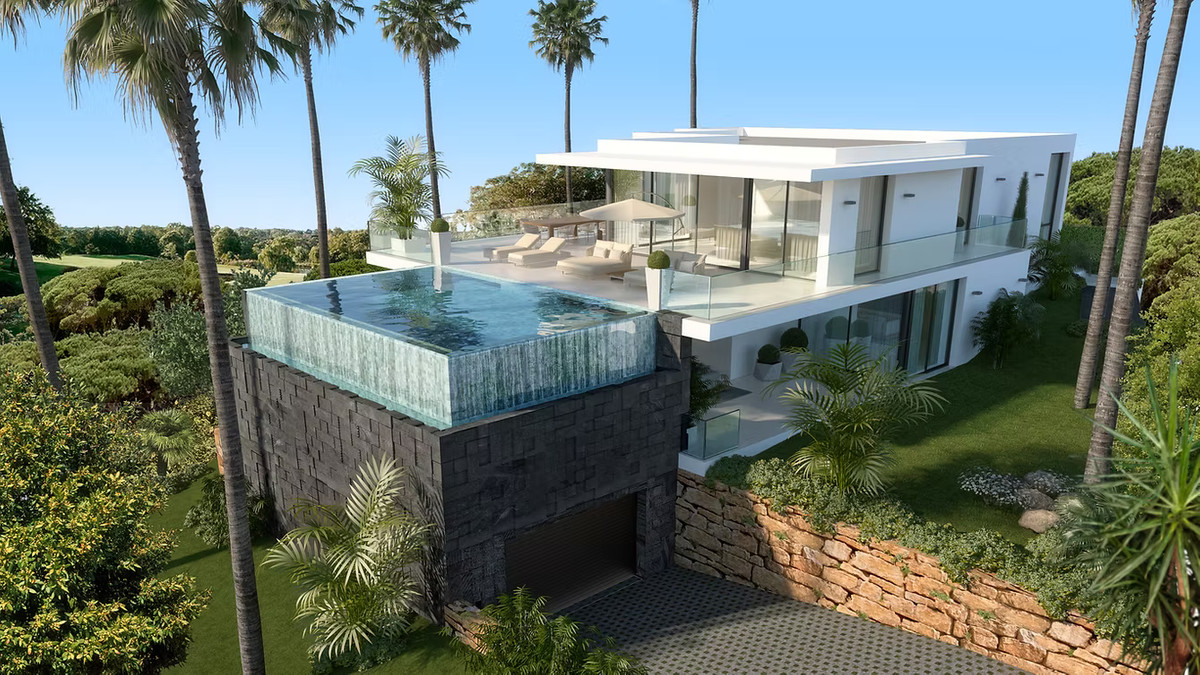 Cabopino Gardens – Villa 11 – Cabopino - modern luxury villa exterior with rooftop infinity pool, glass terraces and tropical garden