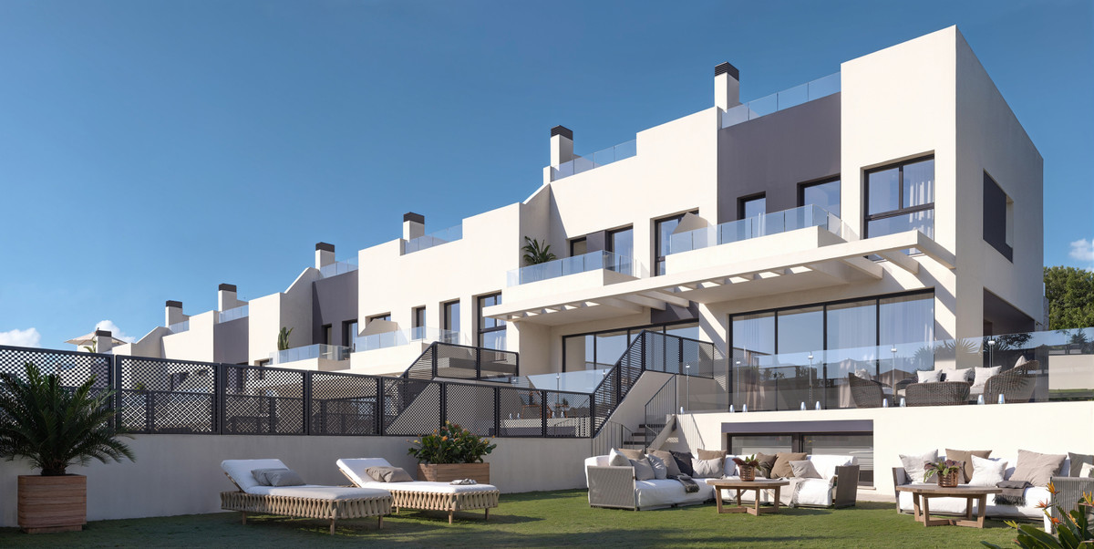 Calagolf by Marinsa – La Cala Golf - modern white terraced townhouses with glass balconies and landscaped garden lounge area