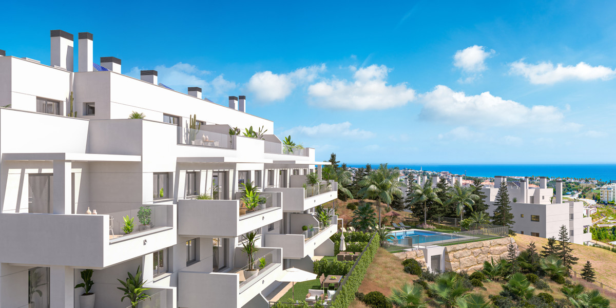 Célere Sunrise – Mijas - modern white apartment complex with terraces, lush gardens, communal pool and sea views