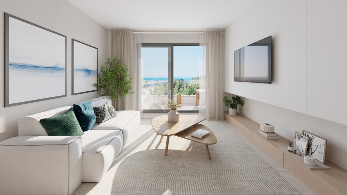 Célere Sunrise – Mijas - bright modern living room with sea views, white sofa, wooden coffee table and floor-to-ceiling sliding doors