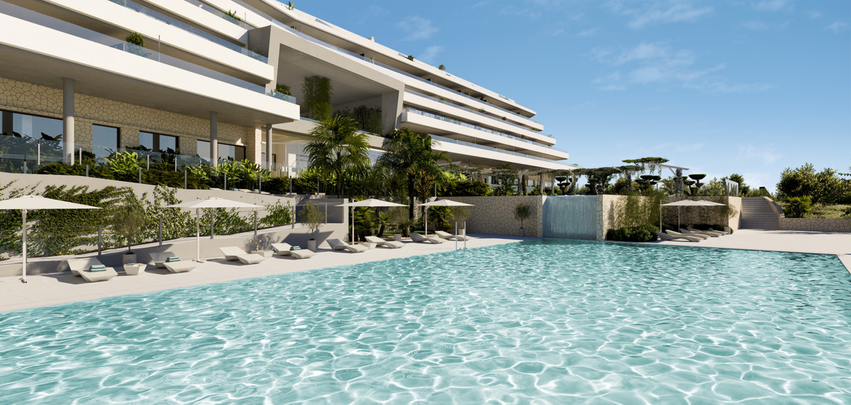 CORE HIGUERON Fase II – Fuengirola - luxury outdoor pool with sun loungers and tropical landscaping beside a modern white residential building