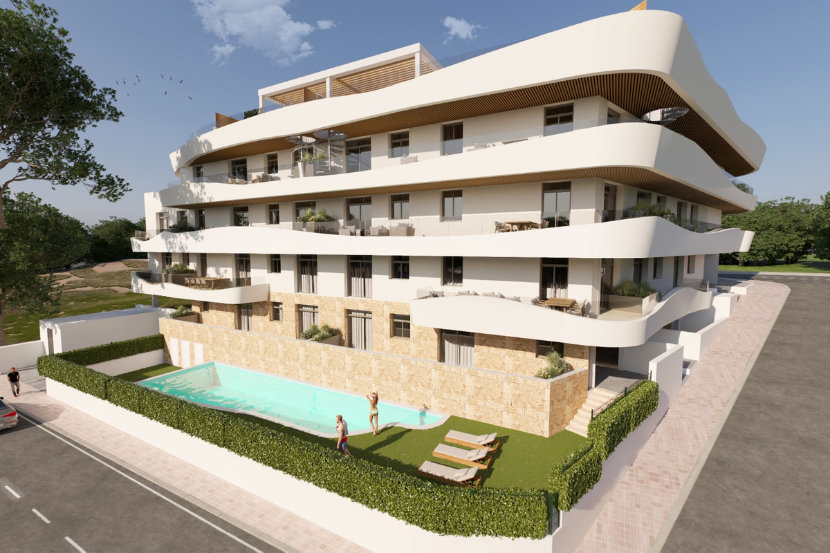 Green Mountain 1 – Estepona - luxury residential exterior with rooftop terrace, curved white facades, and communal pool surrounded by manicured hedging