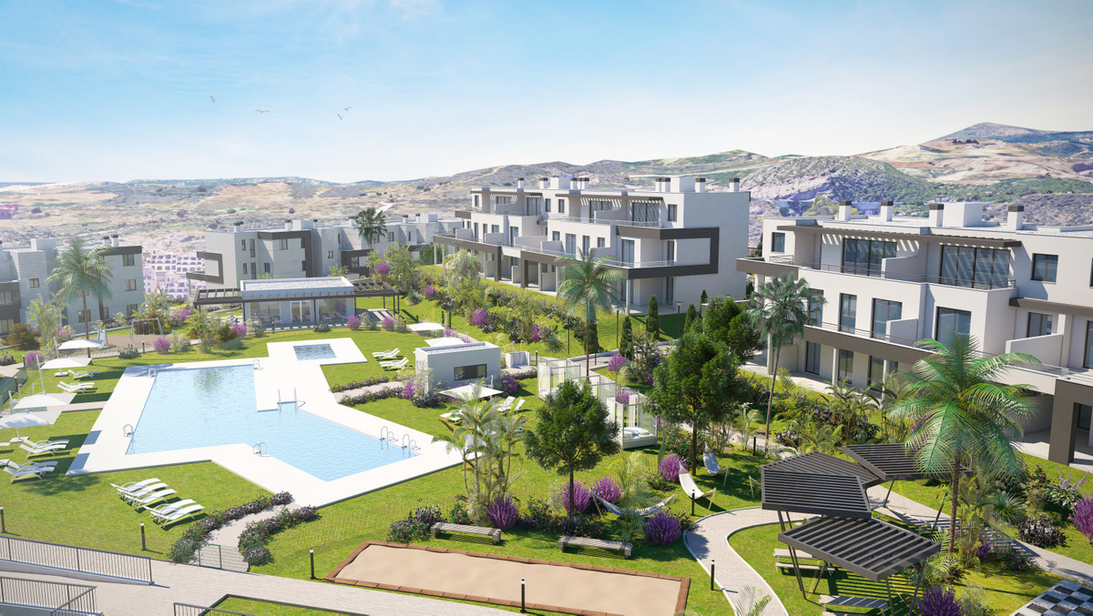 Habitat Valle Romano – Estepona - luftfoto af fælles pool, landskabshaver og moderne hvide bygninger med bjergbaggrund