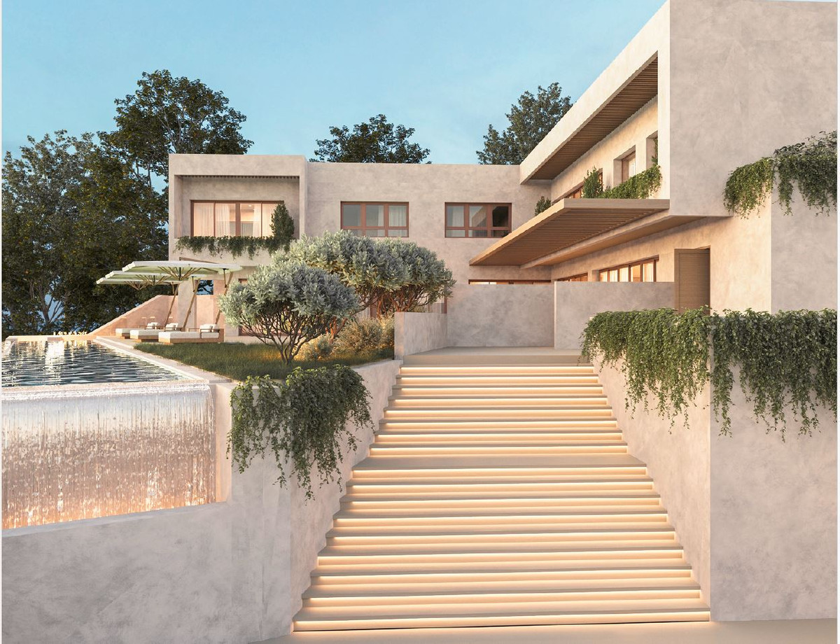 HL SG122 – Alhaurín el Grande - illuminated exterior staircase leading to multi-level luxury villa with infinity pool and landscaped gardens