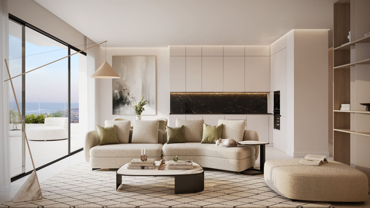 Horizonte Village – The Residences – Mijas - åben stue med boucle-sofa, marmor køkkenpanel og panoramisk havudsigt