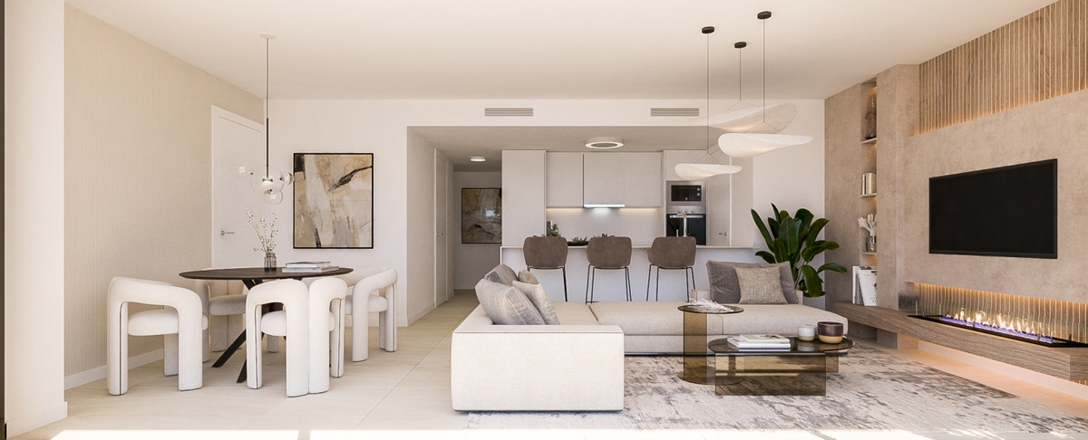 Idyllic – Estepona - open woon- en eetruimte met moderne keuken, open haard en neutrale tinten