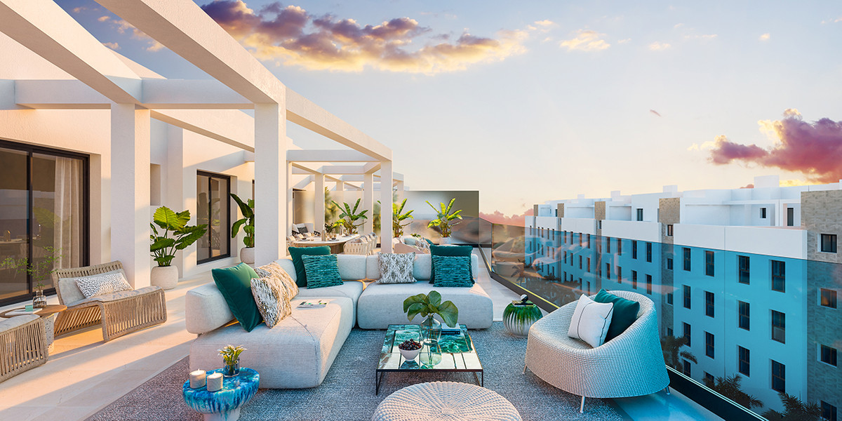 Jardines de Las Lagunas Fase II – Las Lagunas - luxury rooftop terrace with outdoor lounge seating, teal cushions, and sunset sky views over Málaga