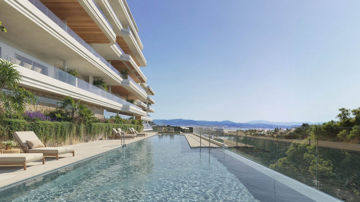 Kosmos – Torremolinos - infinity pool with glass balustrade beside luxury apartment building and panoramic sea views