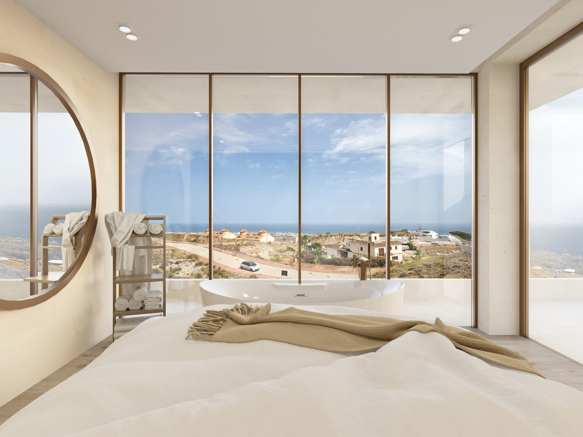 La Roca 2 – Benalmadena - luxury bedroom with freestanding bathtub and panoramic sea views through floor-to-ceiling windows