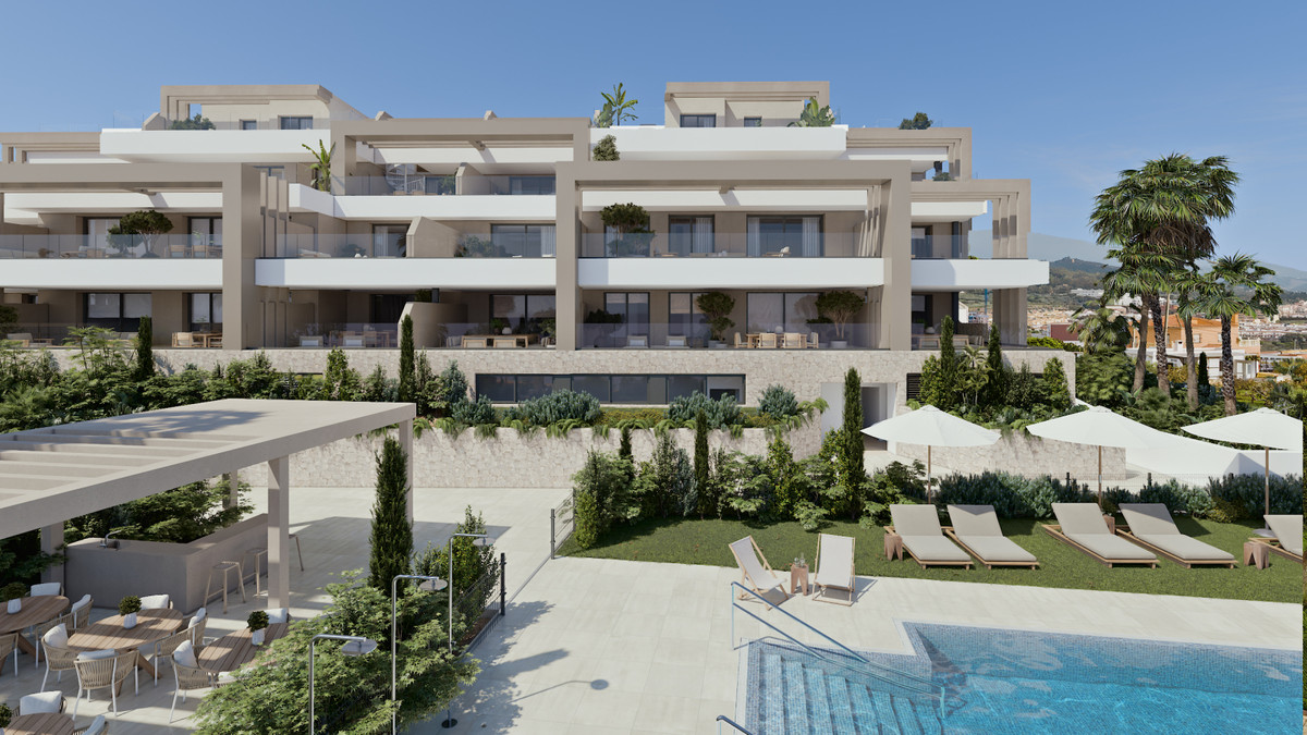 Las Mesas Infinity Homes – Estepona - luxury residential exterior with communal pool, landscaped gardens and terraced balconies