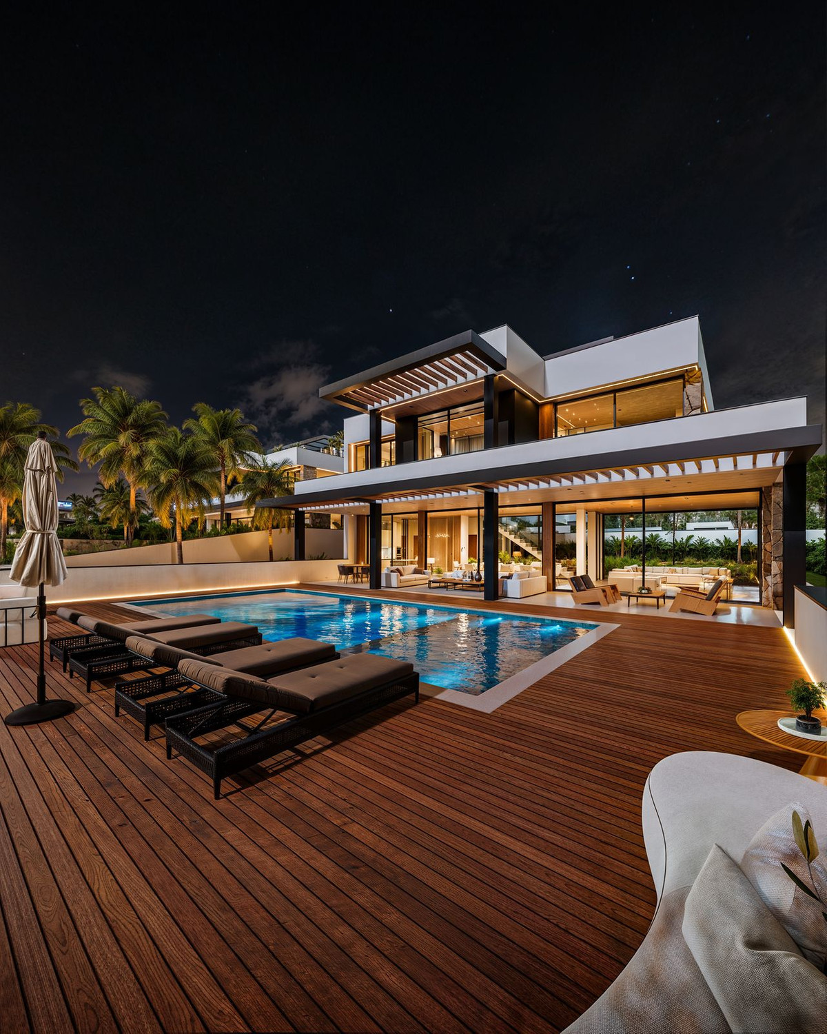 Manzanilla 12 – New Golden Mile - luxevilla exterieur met verlicht zwembad en houten terras bij nacht