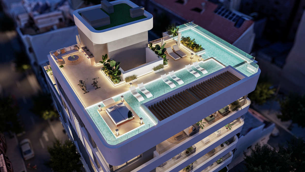 Milabeka – Málaga - luxury rooftop terrace with infinity pool, sun loungers, outdoor seating and fitness area at dusk