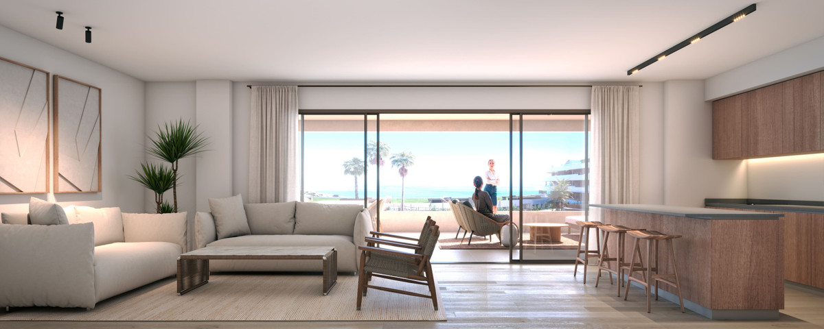 Morasol – Building 1 – Manilva - open woon-keuken met grote schuifdeuren naar een terras met zeezicht