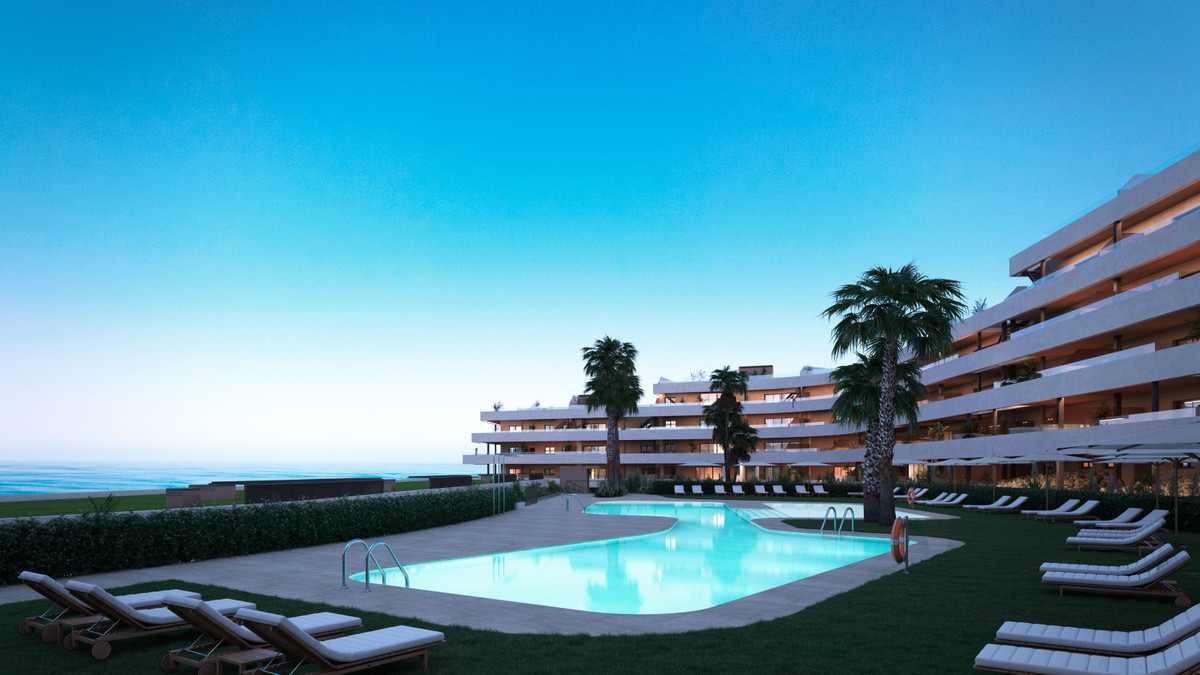 Morasol – Builiding 2 – Manilva - outdoor swimming pool, sun terraces and modern apartment facades at dusk with sea views