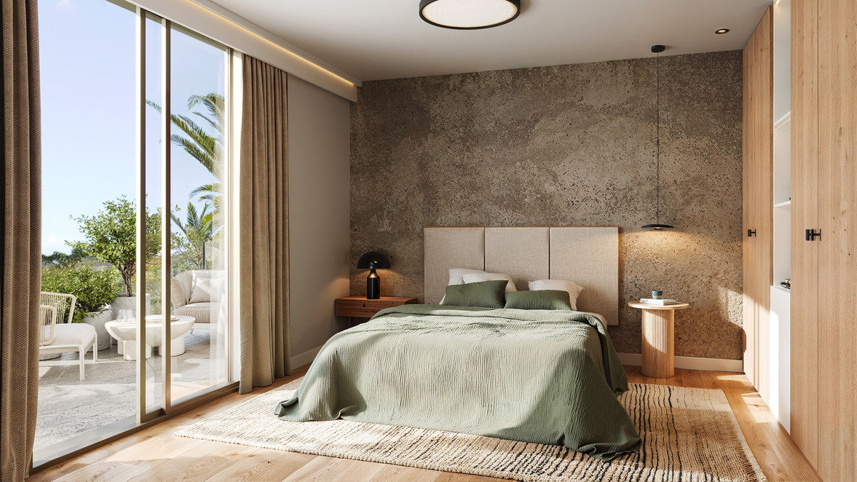 Lakün – Las Lagunas - luxe slaapkamer met groen beddengoed, structuurwand, houten vloer en toegang tot terras