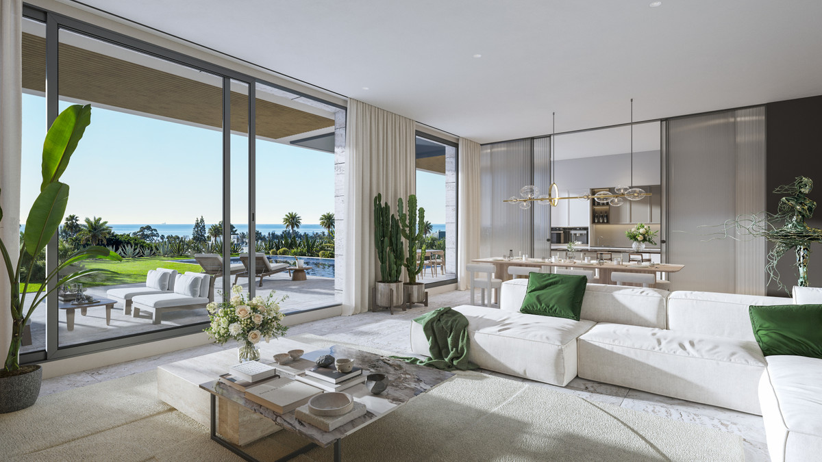 Ocean 11 – Bel Air - bright open-plan living room with white sofa, marble coffee table, cacti, and panoramic sliding glass doors opening to a pool terrace with sea views