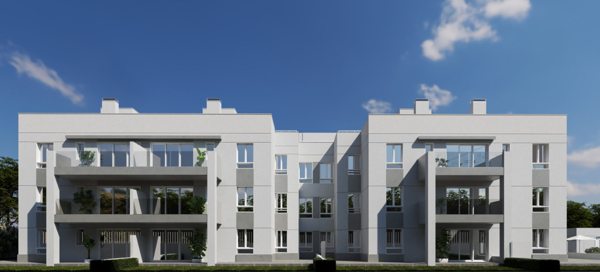 Oceanic Garden – Mijas - moderne hvid trefløjet boligfacade med store glasbalkoer og beplantning