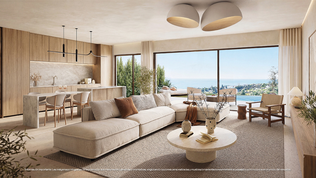Organic Higuerón – Fuengirola – Offener Wohnbereich mit cremefarbenem Sofa, rundem Travertin-Couchtisch und Panorama-Meerblick