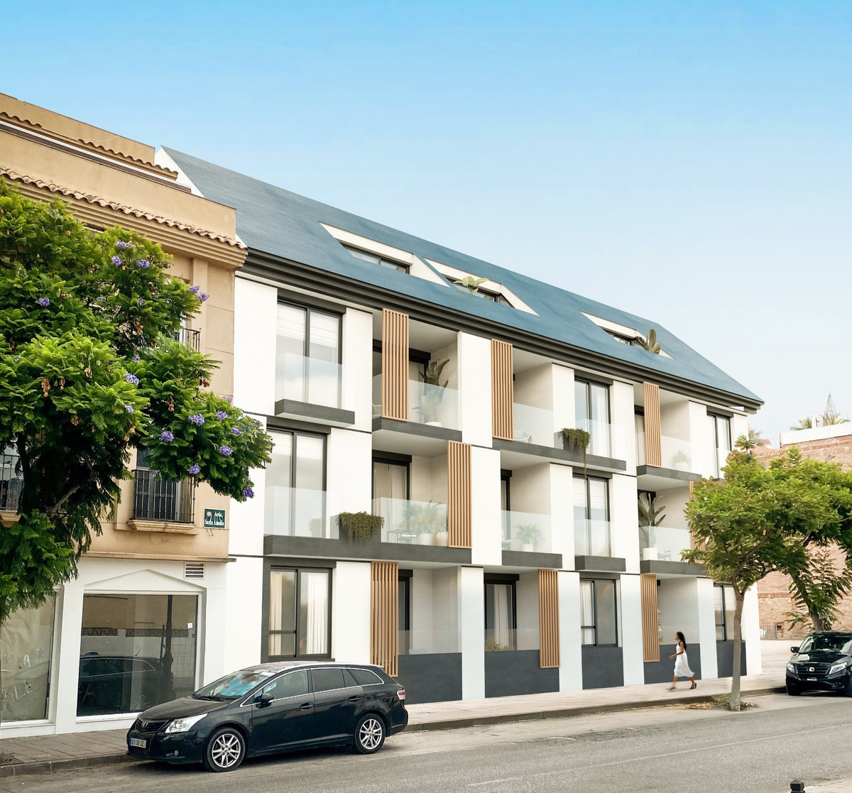 Pelit Maritimo – Fuengirola - moderne hvid nybygget lejlighedsfacade med glasaltaner og skifer mansardtag