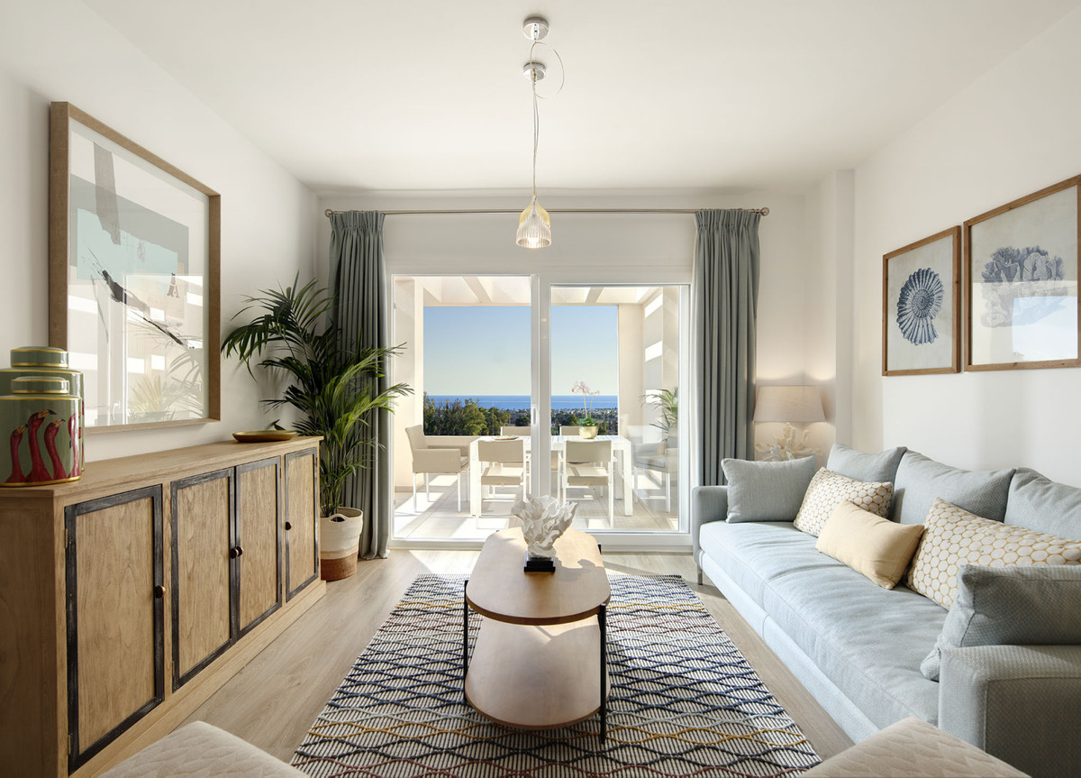 Residencial Albatros XV – Marbella - bright living room with sea views, grey sofa and terrace access