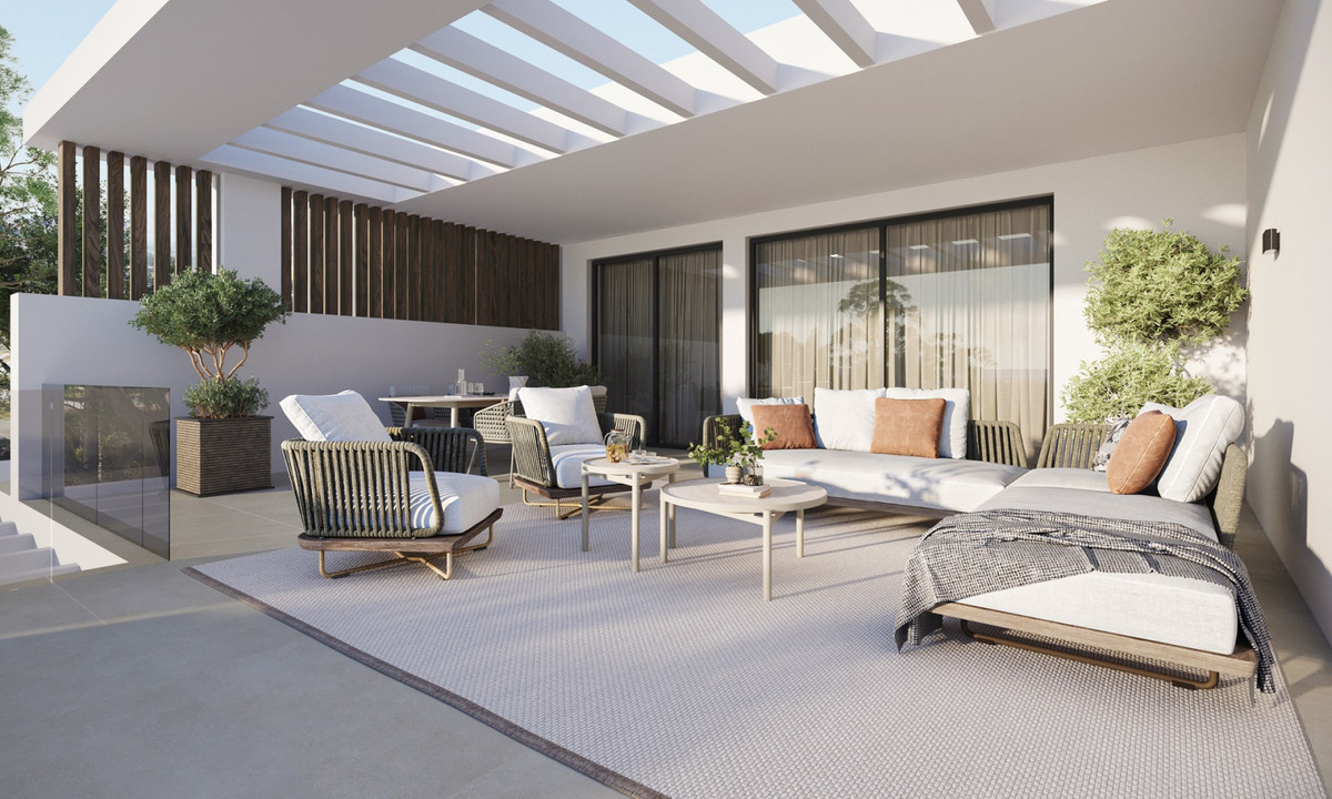 Royal Park Residence – New Golden Mile - shaded outdoor terrace with rope-weave lounge chairs, large sofa, daybed and pergola roof