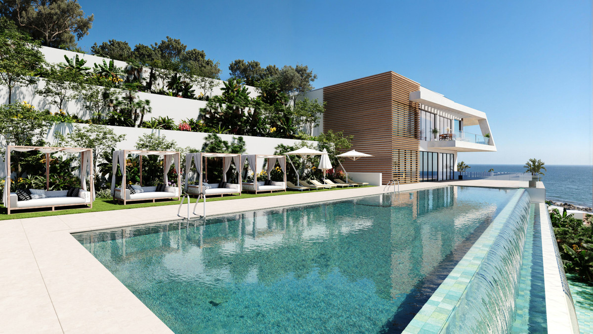 Serenity Hills – Elviria - infinity pool met cabanas, weelderige terrassen en zeezicht