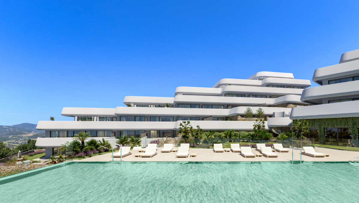 Skye Casares Golf – Casares - terraced white contemporary facade with infinity pool, sun loungers and landscaped gardens