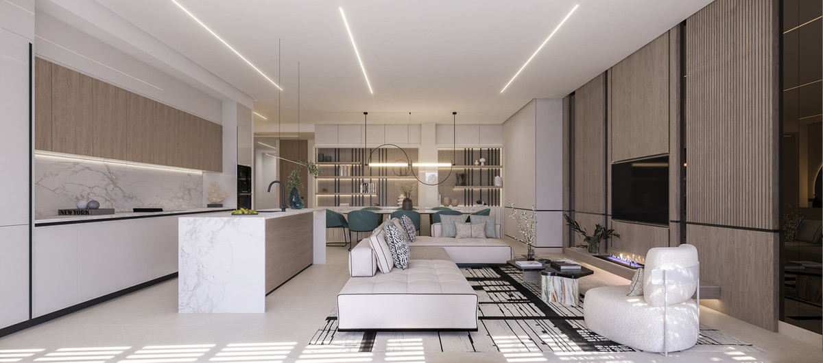 Solenne – Benahavís - open-plan living room and kitchen with marble island, white sofas, and linear ceiling lights