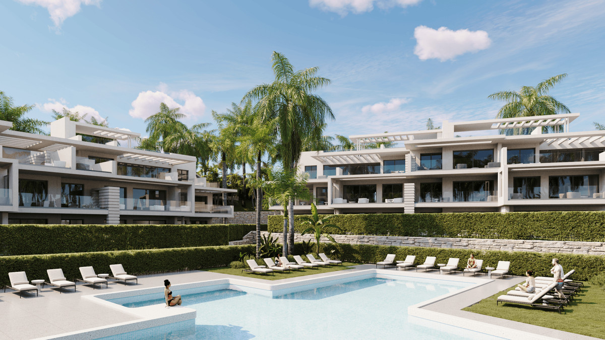Sunway Residence – Estepona - luksuriøs udendørs pool, solterrasser og moderne hvide bygninger omgivet af palmer og frodig beplantning