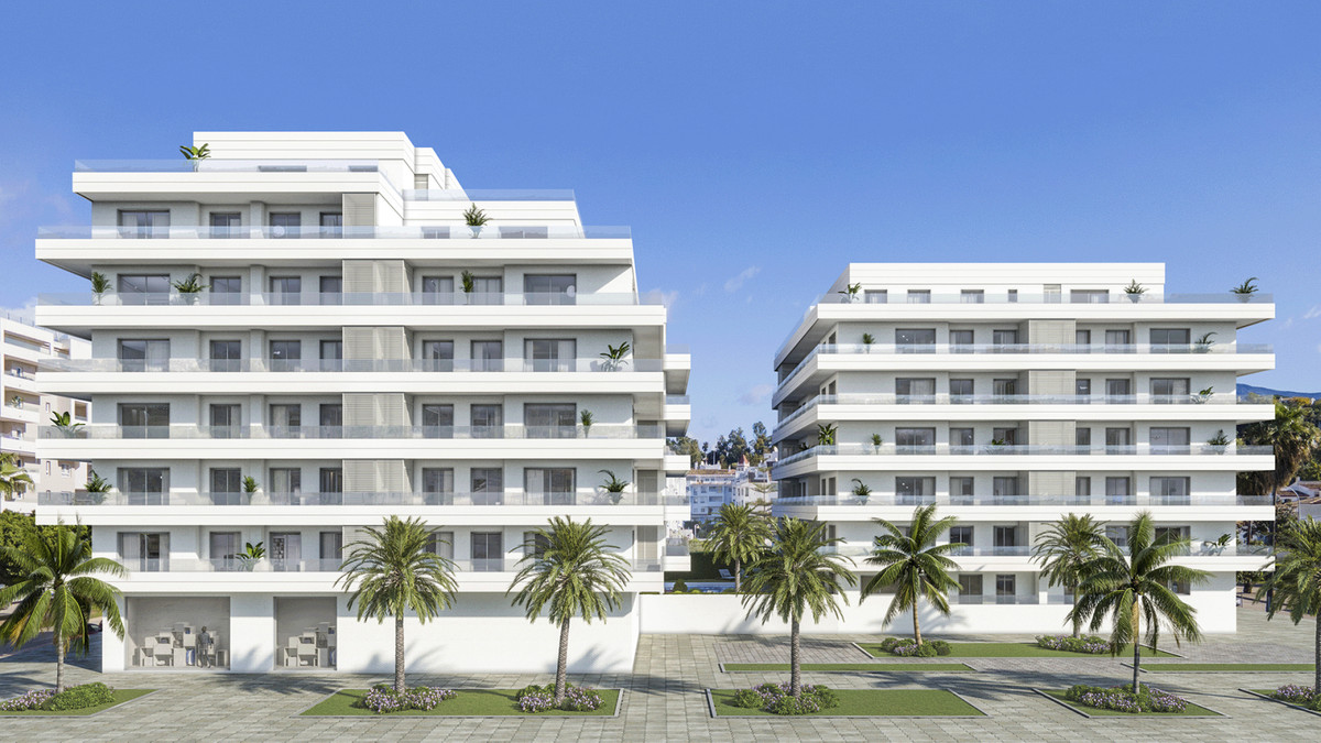 Terrazas de Guadaiza I – Nueva Andalucía - white modern residential facades with palm trees and glass balconies under blue sky