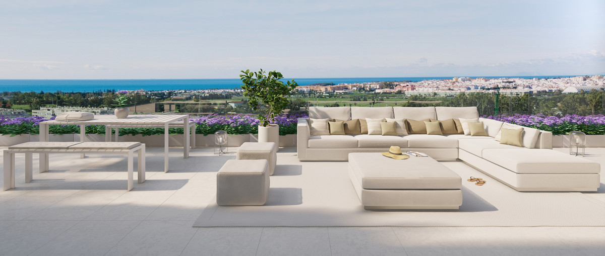 Terrazas de Guadaiza I – Nueva Andalucía - rooftop terrace with L-shaped sofa, dining area, and panoramic sea and coastal town views