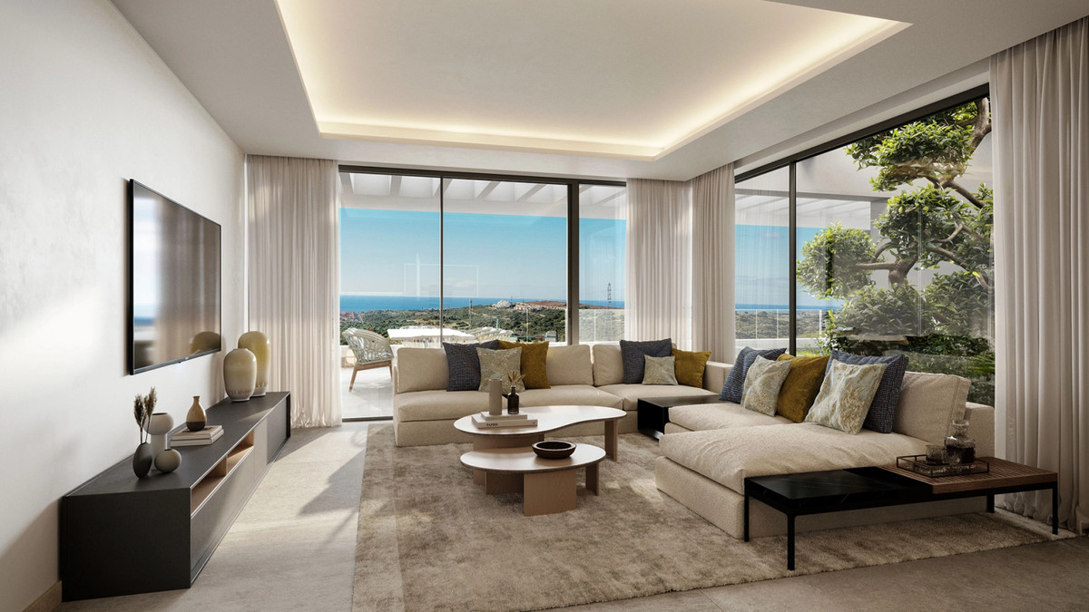 The Place Alcazaba – Casares - bright open-plan living room with large sectional sofa, floor-to-ceiling windows and panoramic sea views