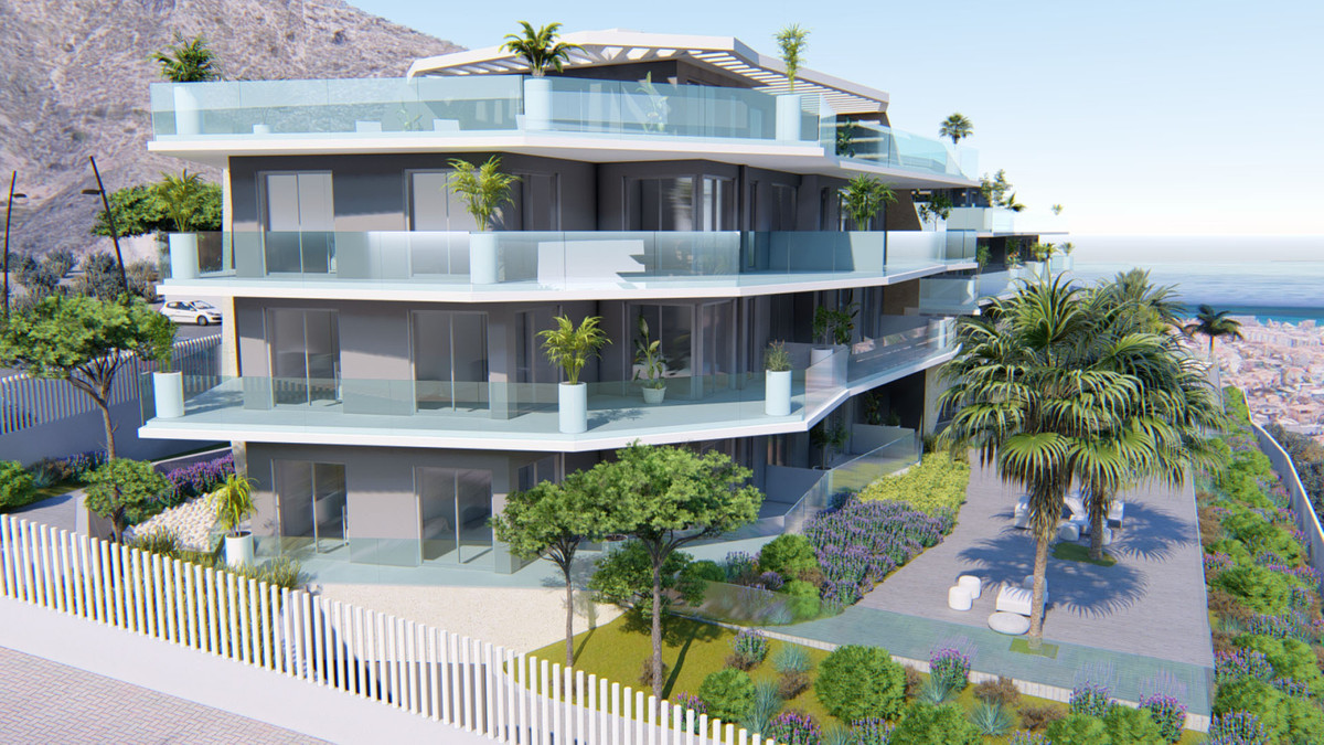 Top Views – Benalmadena - modern luxury apartment building exterior with glass balconies, terraces, and landscaped gardens overlooking the sea