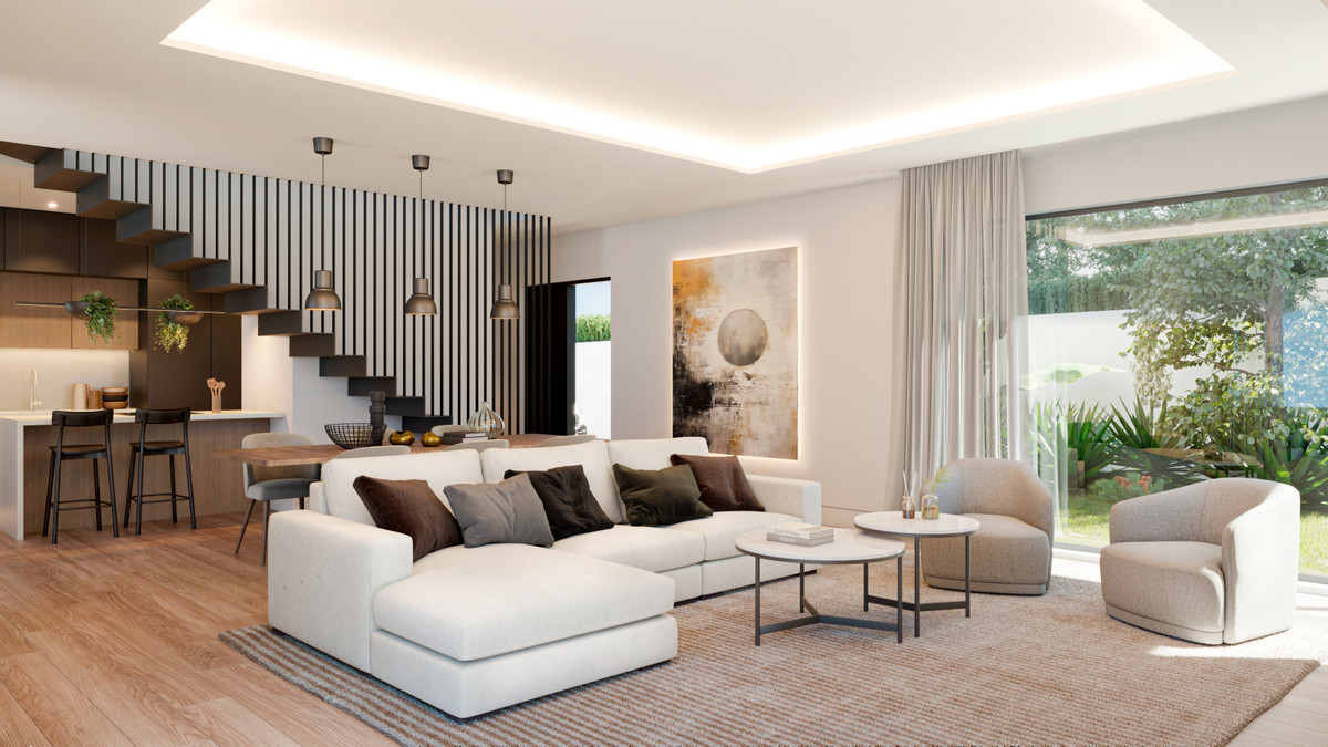 Villa Aitana – Mijas - open-plan living room with white sectional sofa, floating staircase, and floor-to-ceiling garden views