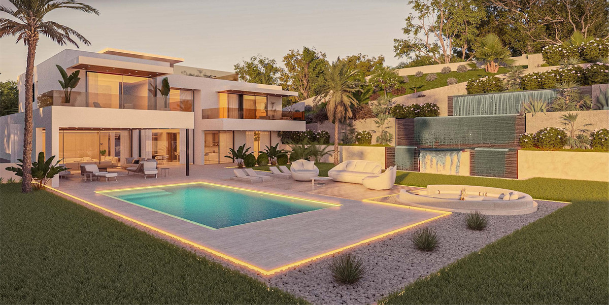 Villa Awa – Elviria – moderne Luxusvilla mit beleuchtetem Pool, Terrasse, Jacuzzi und gepflegtem Garten in der Abenddämmerung